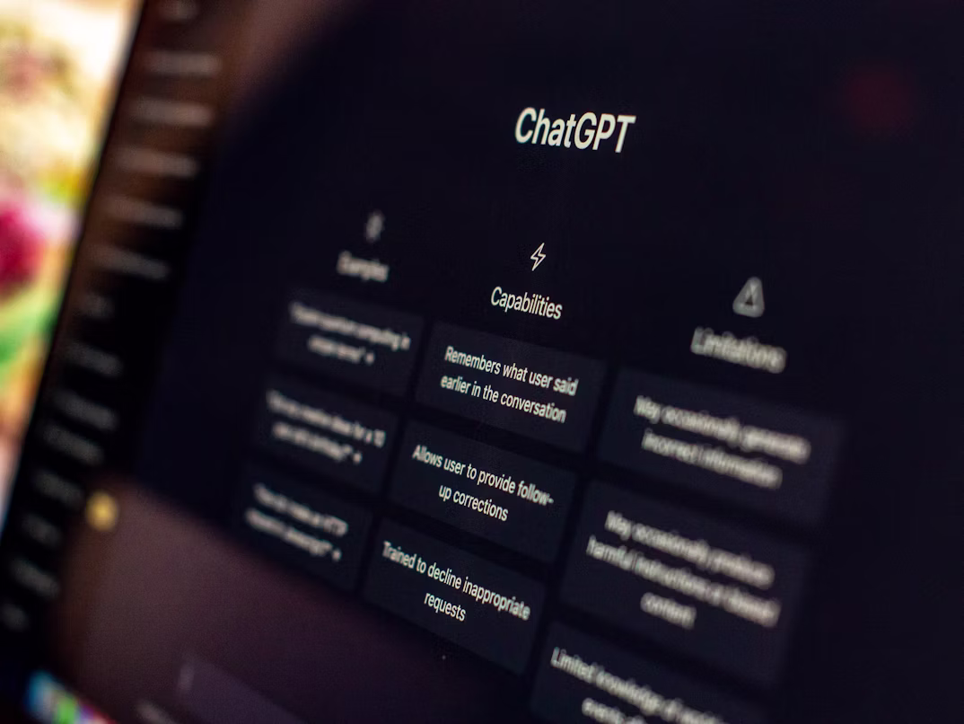 Business owner reviewing how their company appears in ChatGPT AI search results on a laptop